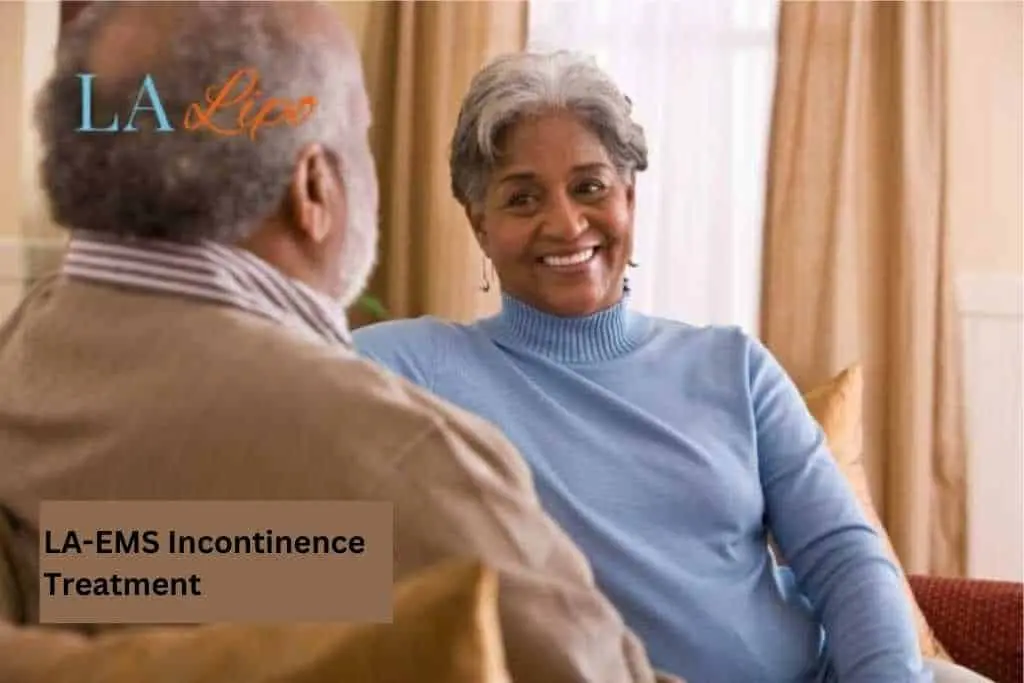 Couple sat smiling at each other - LA-EMS treatment East Bedfont