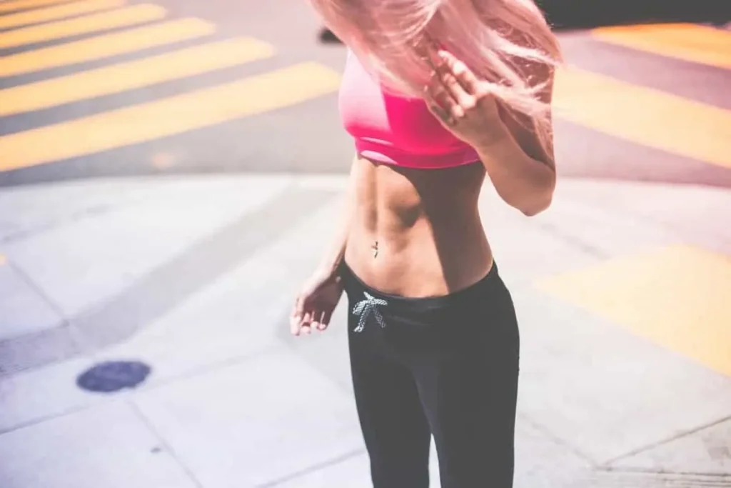 Woman with toned stomach after LA-EMS Body Sculpting Treatment East Bedfont
